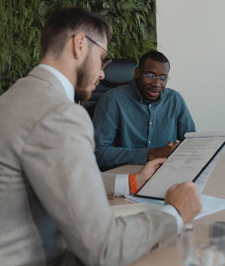 interviewer looking through form