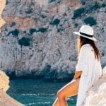 Woman sitting on rock