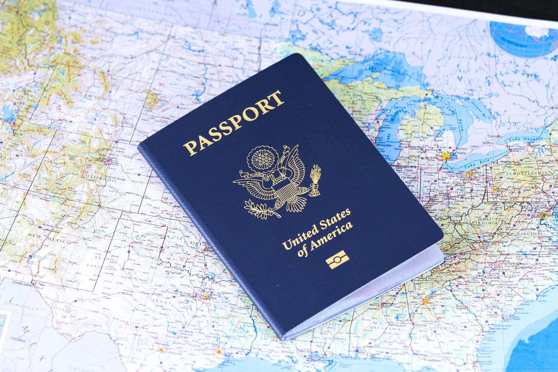 a US passport placed on a map