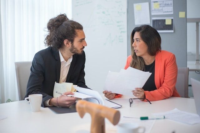 man and women with documents