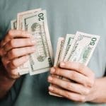 Man holding money in both hands