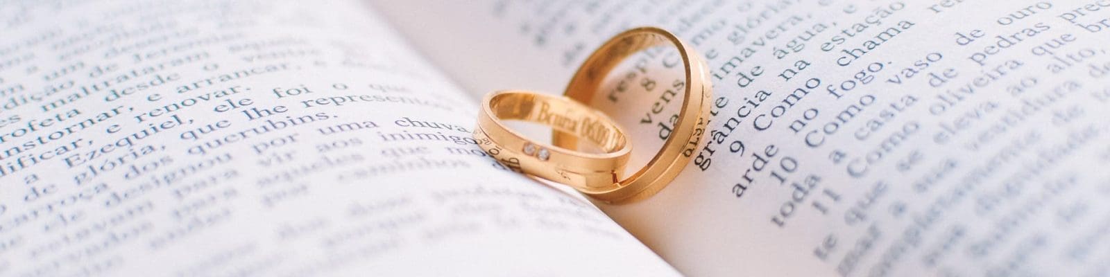 wedding rings on top of a book