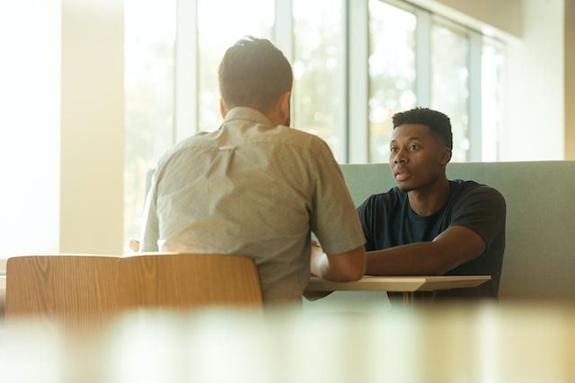 two people discussing to represent an employer and employee
