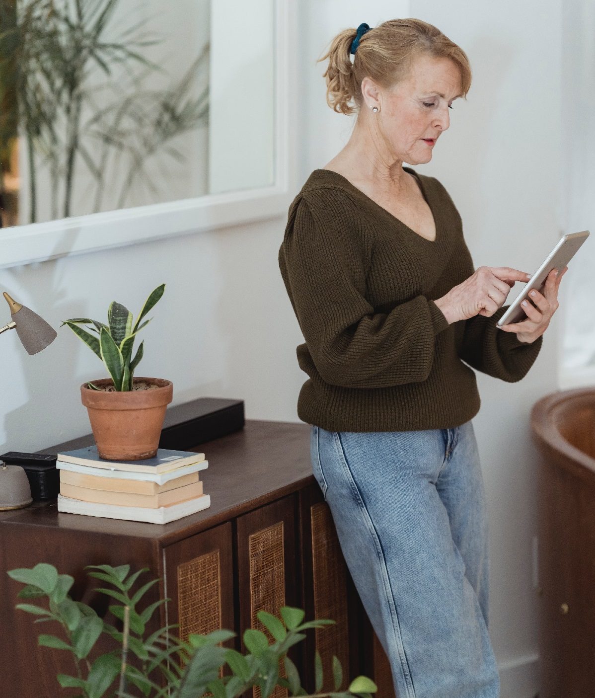 Woman going through document on tablet