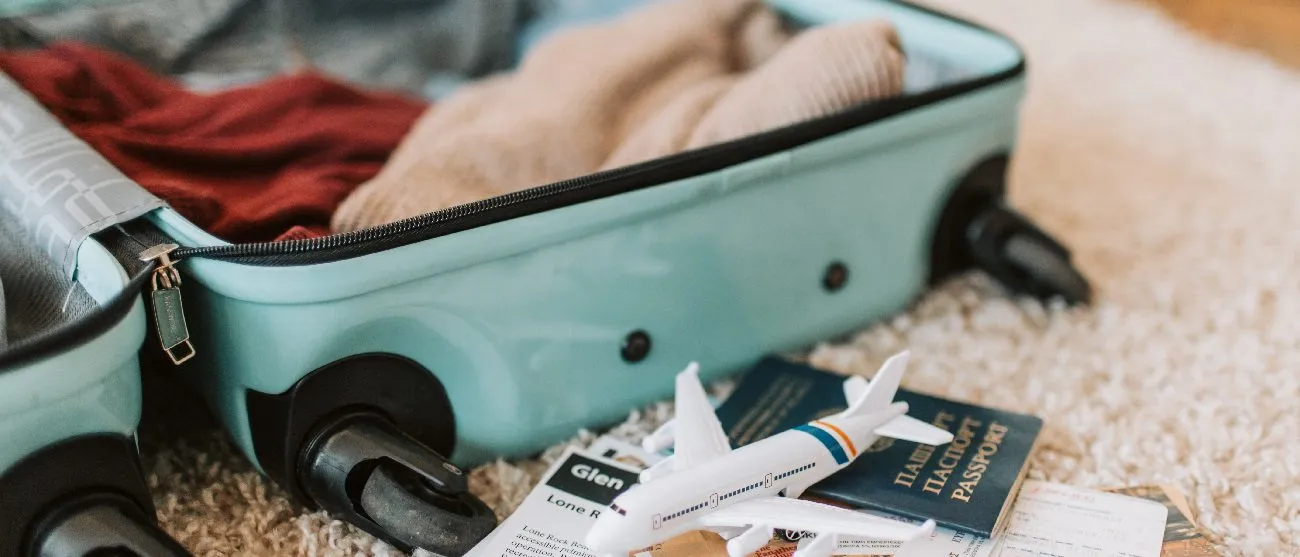 Suitcase and travel documents