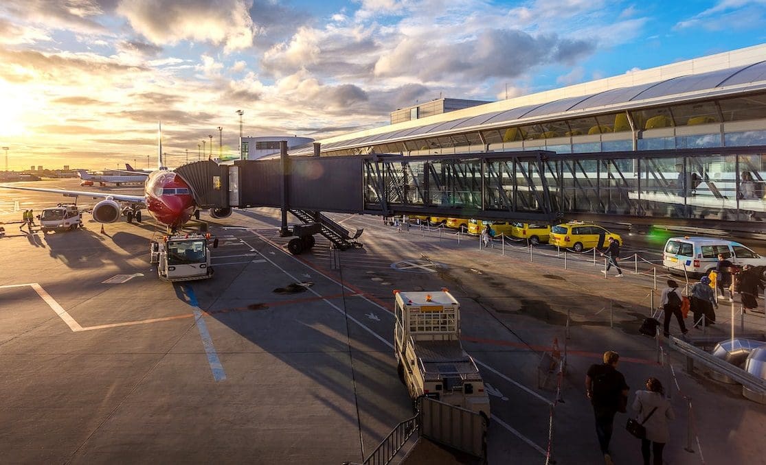 People heading toward plane on runway
