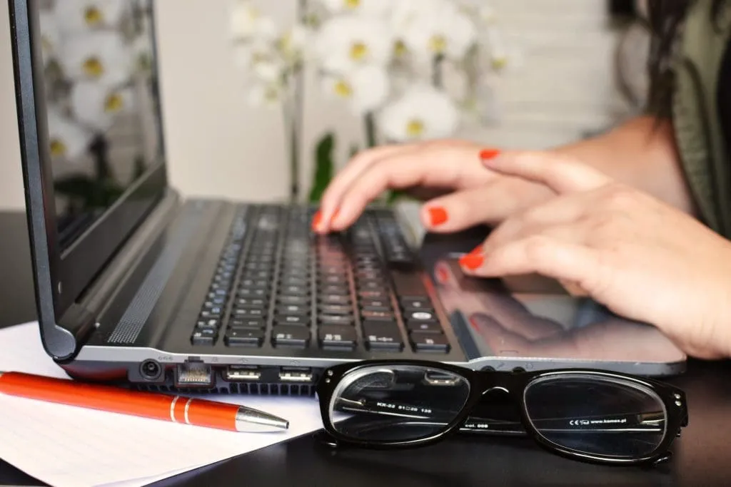Close up of someone using a laptop
