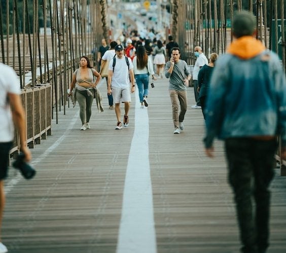 People walking on footbridge