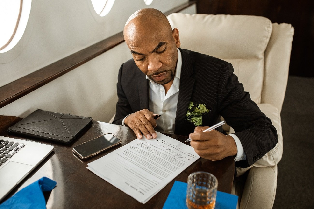 Signing documents on private jet