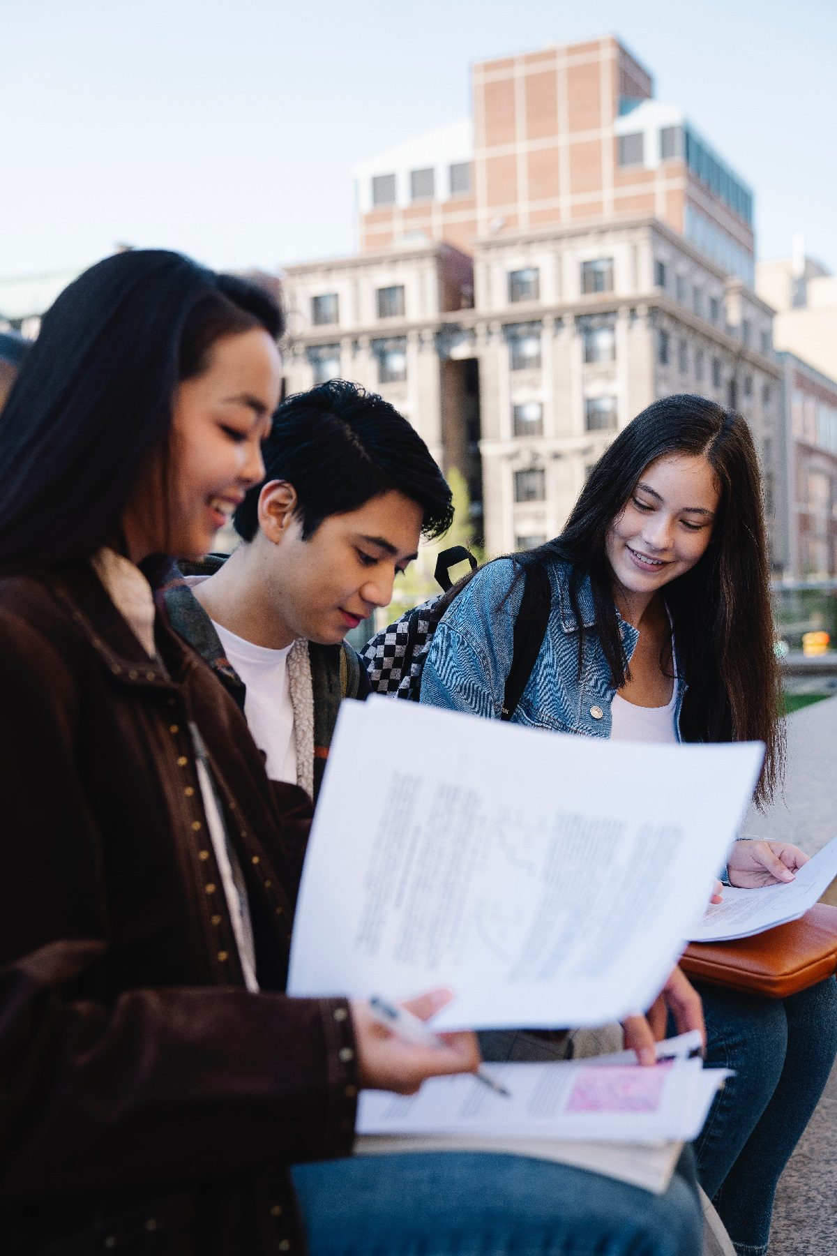 Friends looking through documents