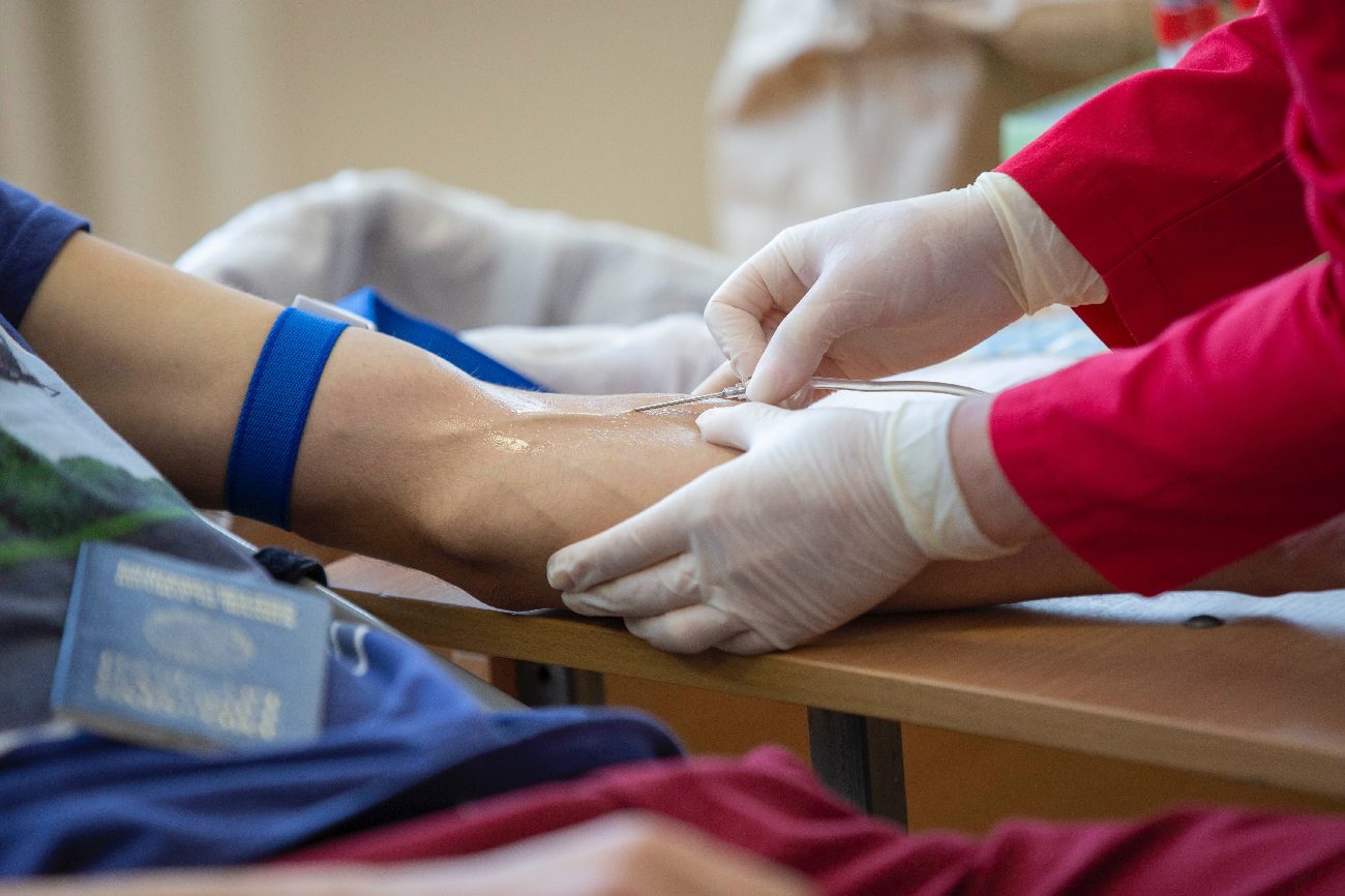 Nurse inserting i-v needle