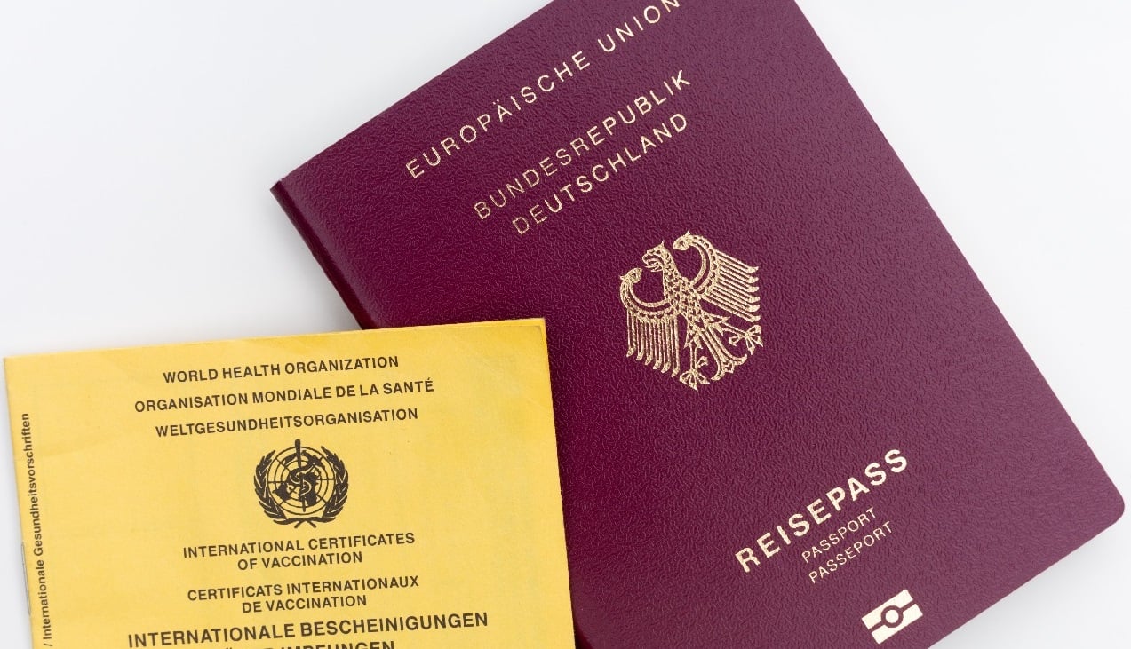 German Passport with WHO pamphlet