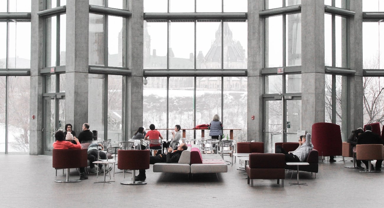 People sitting in waiting area of corporate office