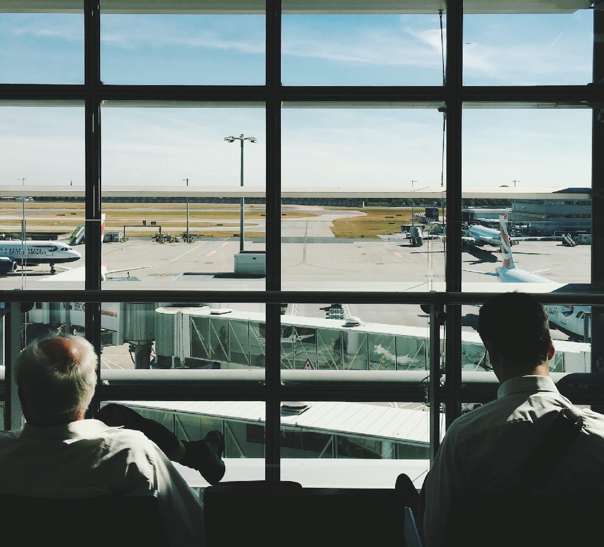 Men waiting at airport