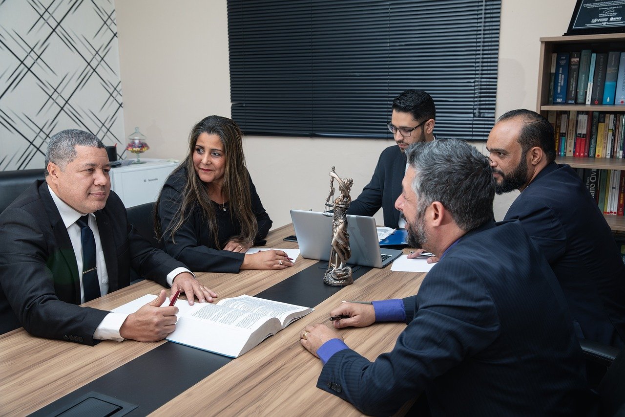 a group of lawyers gathered around a table