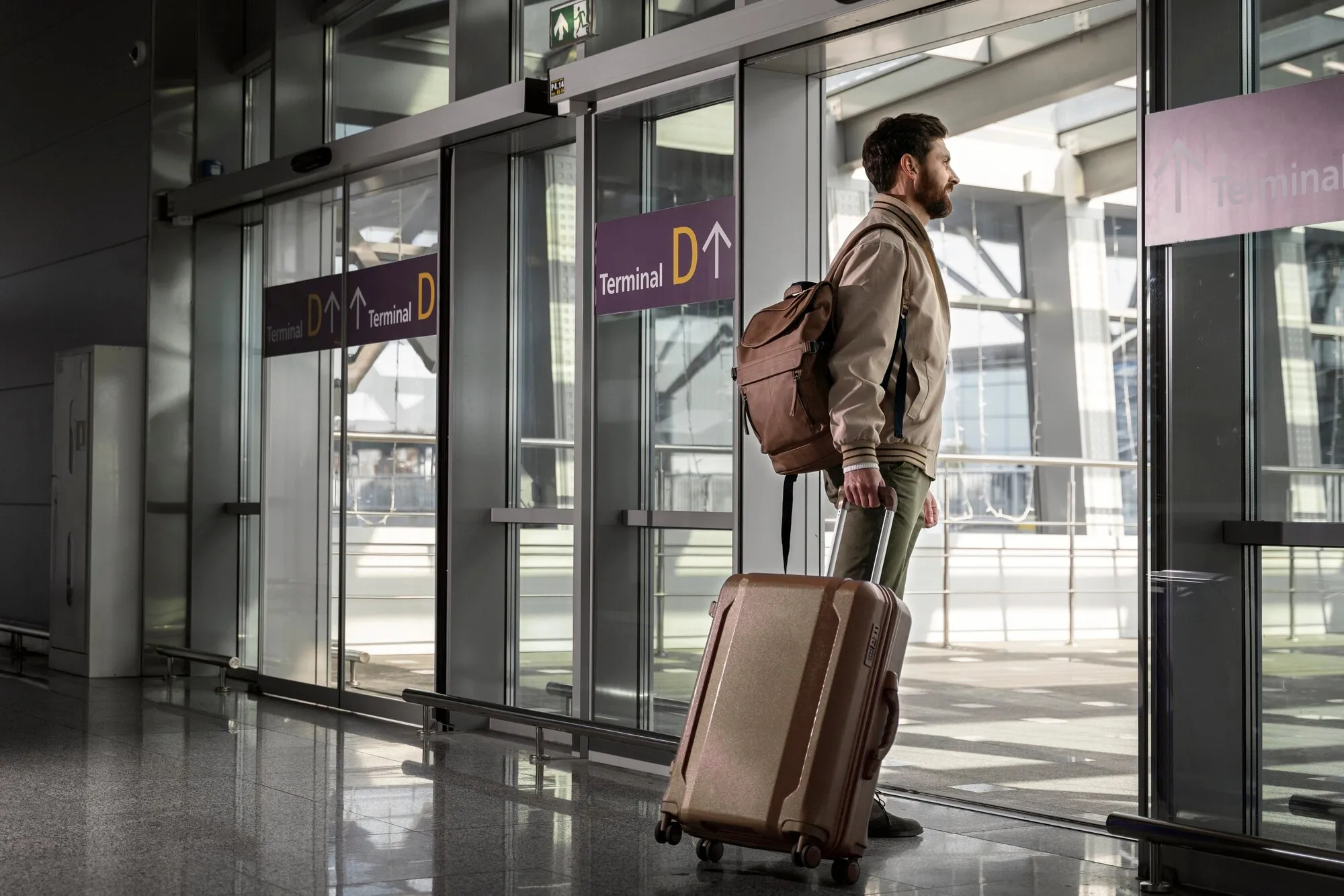 a man holding a luggage at the airport