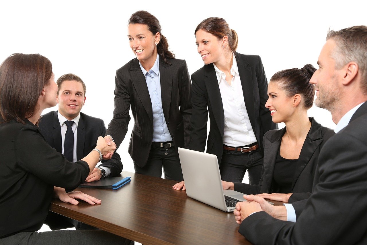 a group of businessman gathered around a table