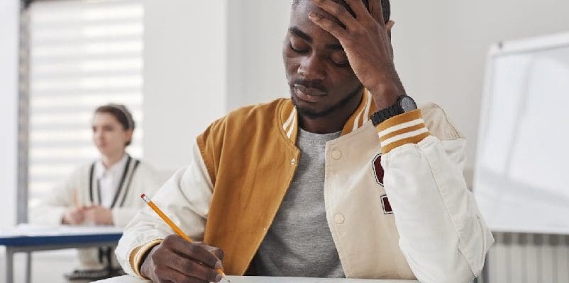 Student in class, taking a test