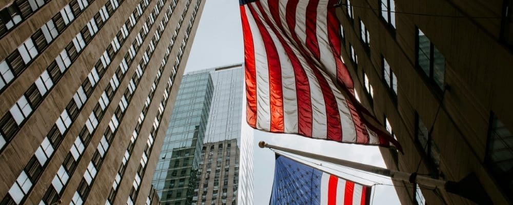 US flags handing down in a US city street