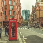 People on London street, by red telephone booth