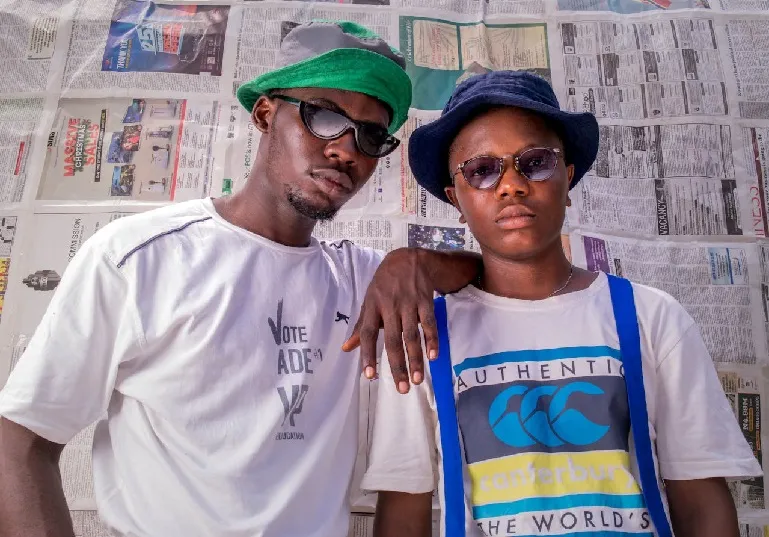 Two Nigerian men standing next to each other