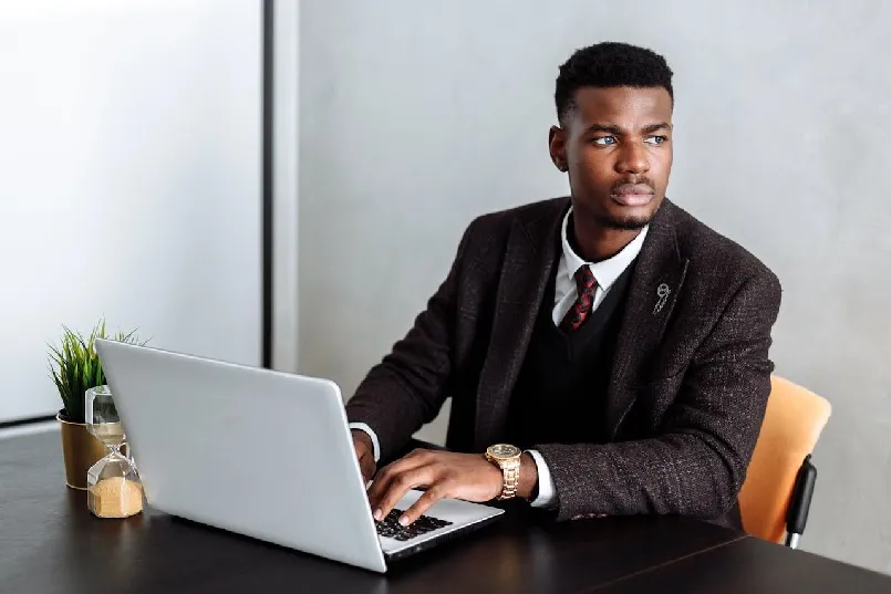 Nigerian lawyer on his laptop