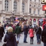 People waiting for bus in busy London street