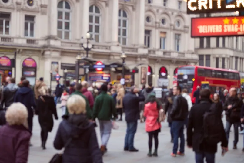 People waiting for bus in busy London street