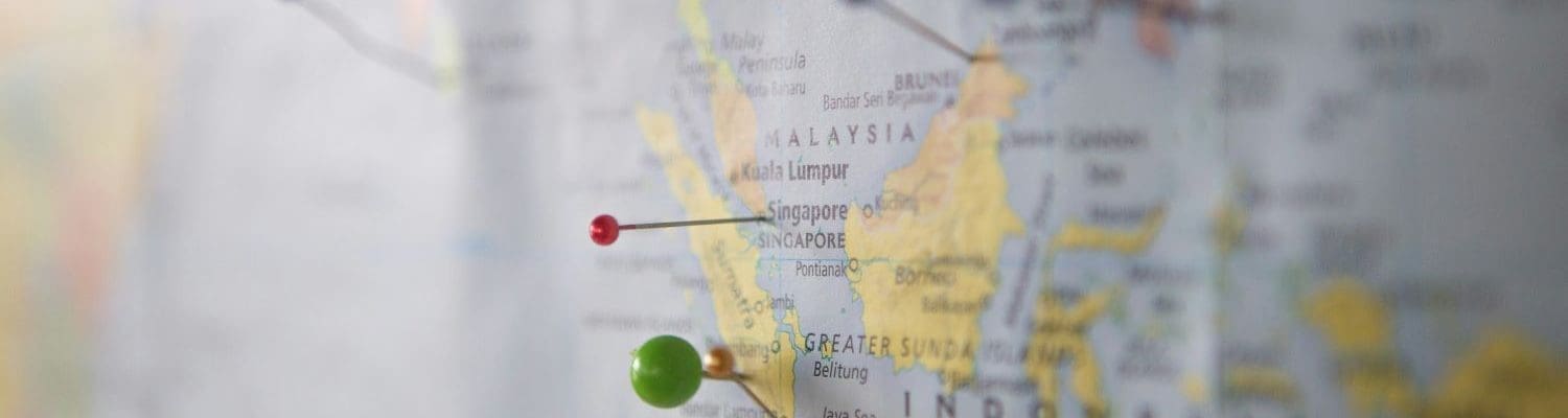 global map with pins in it