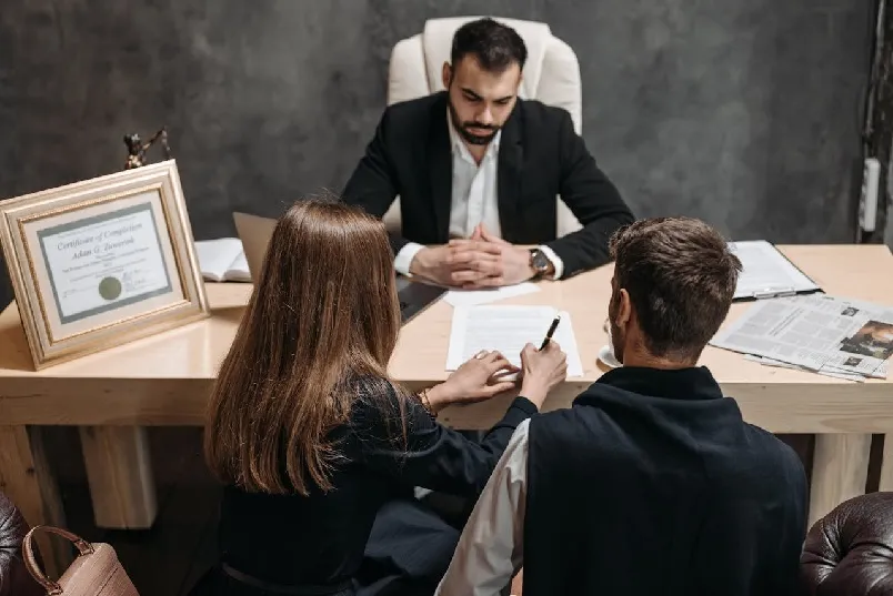 Lawyer having discussion with his clients