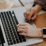 Person typing on laptop