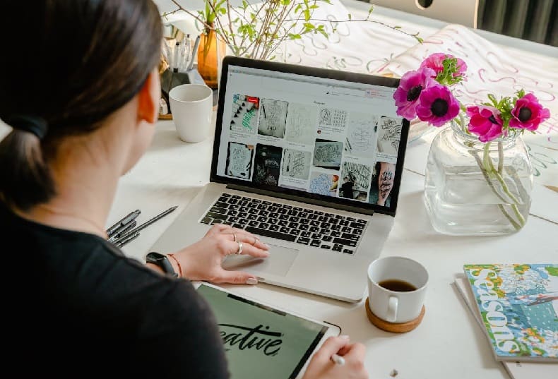 Woman using laptop on desk