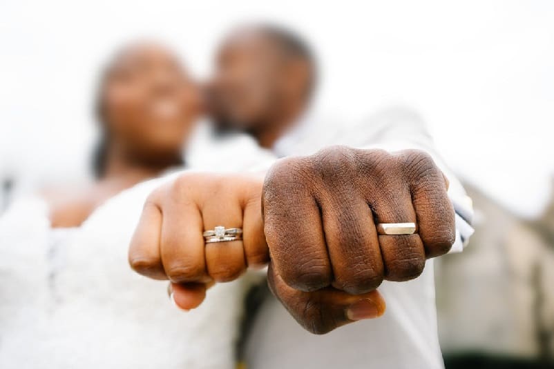 Close-up of newly weds wedding bands