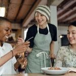 Women at a table, enjoying each other's company